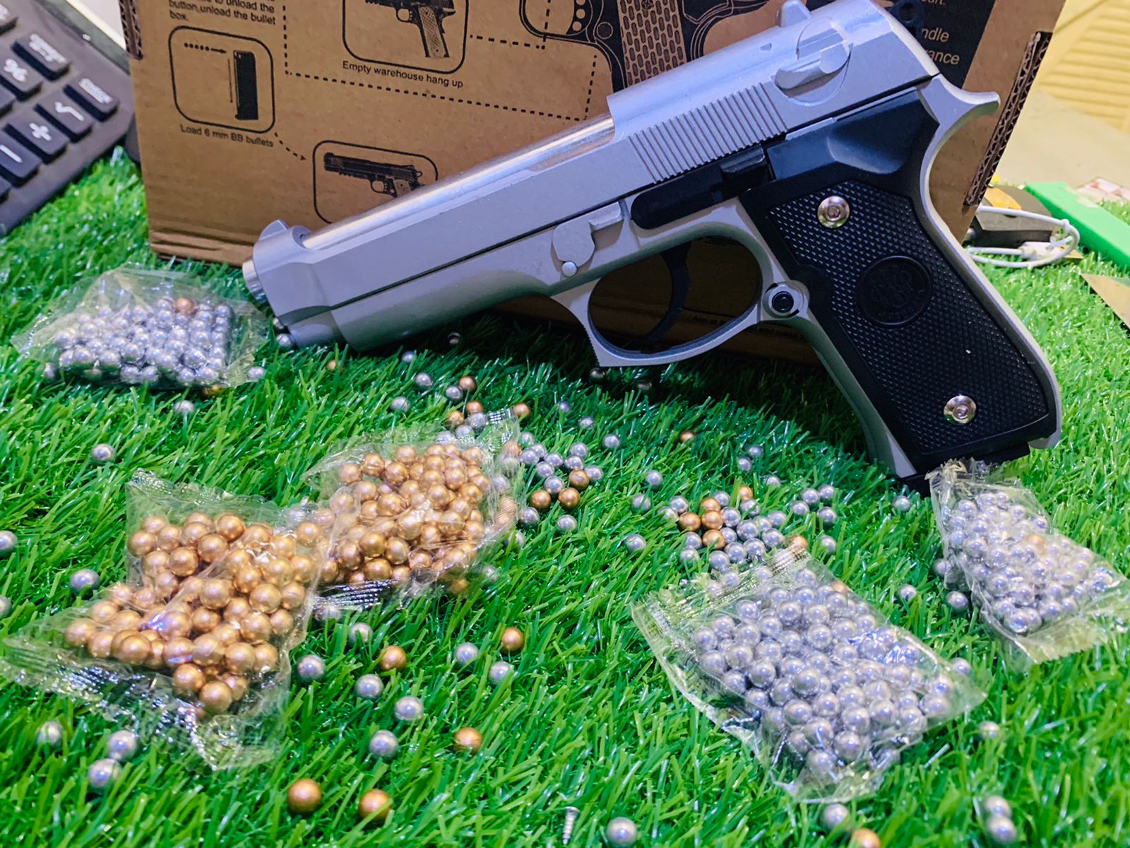 BRETTA MODEL SILVER COLOUER BB BULLET TOY MACHINE PLASTIC BODY AND METAL PARTS AND WEIGHT FOR BEST LIKE REAL MACHINE